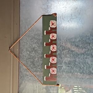 Hand painted wood Ho Ho Ho sign.